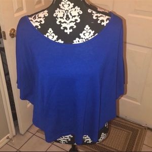 Delia’s open back blue top